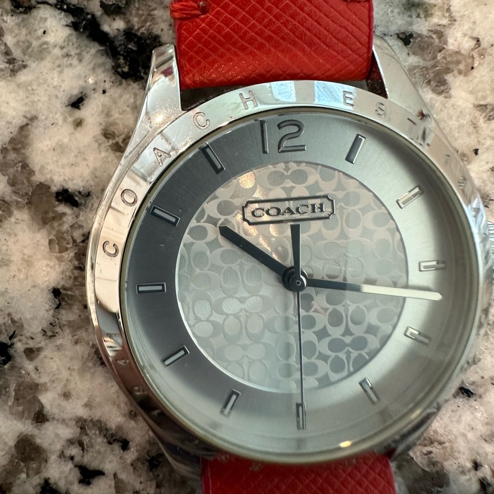 Beautiful vintage Coach watch with red leather band.